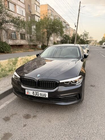 приборка бмв: Автомобиль BMW 5 серии в темном цвете. Салон отделан кожей коньячного