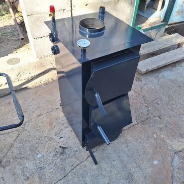 Котлы: Твердотопливный водогрейный котёл с варочной поверхностью Описание: - — 1