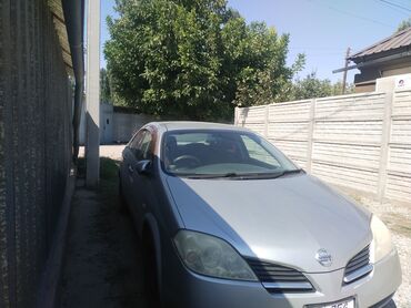 н мах: Nissan Primera седан, правый руль, серебристый цвет кузова. Кузов и