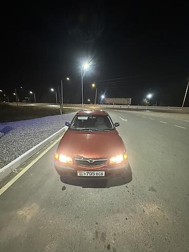 глушитель ауди: Mazda 626: 1998 г., 1.8 л, Механика, Бензин, Седан — 3