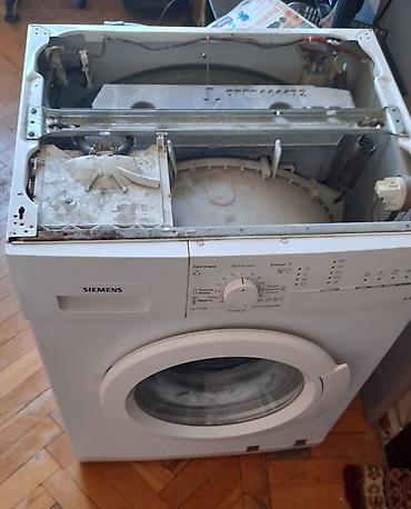 erikson 1018: Siemens E 10-18 modelinin ağ rəngli, ön yükləməli paltaryuyanı. Bu — 2
