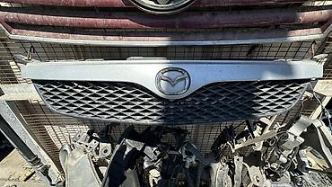 mazda demio решотка: Решётка радиатора Mazda - Оригинальная передняя решётка радиатора — 1