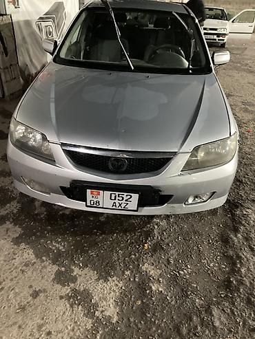 Haima: Mazda Familia: 2002 г., 1.6 л, Кол менен иштөөчү, Бензин, Хетчбек — 3