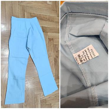 comma pantalone: Svetloplave ženske pantalone marke Tonia, veličine 42. Izrađene su od — 1
