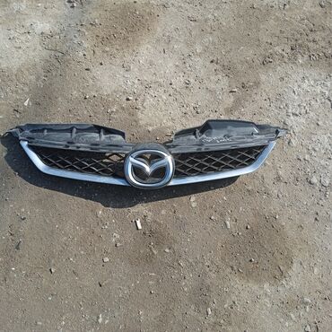 Решетки радиатора: Решетка радиатора Mazda Б/у — 23