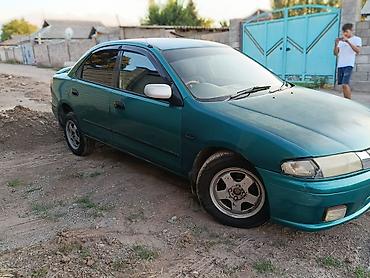 мапет матор: Mazda Familia: 1997 г., 1.6 л, Автомат, Бензин, Седан — 5