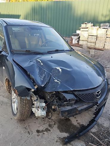 Mazda: Mazda 3, седан (поколение BK). Цвет темно‑серый/черный. Бензин автомат — 6