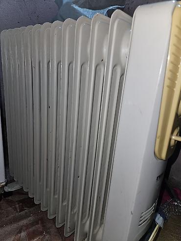 Elektrik qızdırıcısı və dekorativ elektrik kamin. Şəkillərdə iki