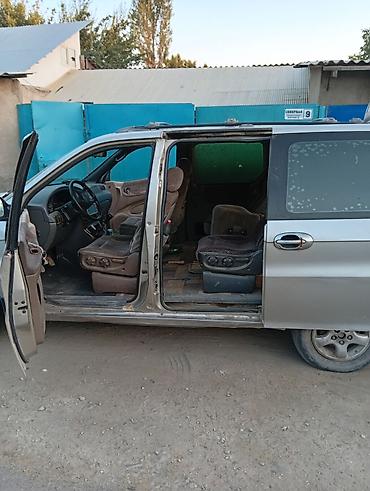 lider auto: Kia Carnival: 1998 г., Минивэн — 7