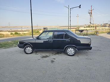 Tofas: Model: Tofaş Şahin (sedan) Rəng: Qara Kuzov: 4 qapı, arxa ötürücü — 6