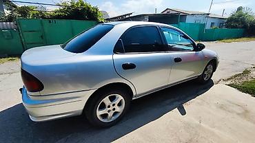 мата секыл: Mazda 323: 1997 г., 1.5 л, Кол менен иштөөчү, Бензин, Седан — 4
