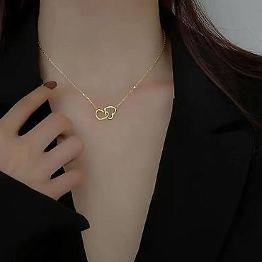 Ogrlice: Ogrlica sa dva isprepletena srca
1300 din — 7