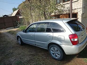 roewe rx5: Mazda 323: 2004 г., Механика, Бензин, Хэтчбэк — 4