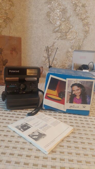 polaroid qiymeti: 90 man teze kimi . ünvan Razin