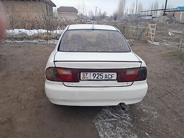Mazda: Mazda Familia: 1995 г., Кол менен иштөөчү, Бензин, Седан — 2