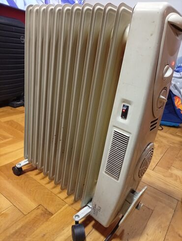 Uljani radijatori: Ulje­ni radijator Midea sa 12 rebara i ispravnim ventilatorom - Tip — 5