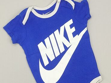 lidl kapcie dla dzieci: Body, Nike, 3-6 miesięcy, 
stan - Bardzo dobry