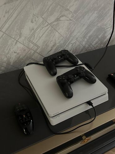 irshad telecom playstation 4: PS4 slim satılır, 1 TB yaddaşı var, problemsizdir, oyunlarla birlikdə