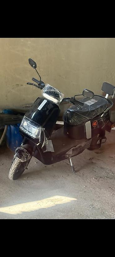 electric moped: Elektrik skuter – şəhərdaxili rahat gediş üçün kompakt və səmərəli — 1