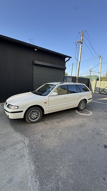 мото зонтик: Mazda Capella: 1999 г., Универсал — 2