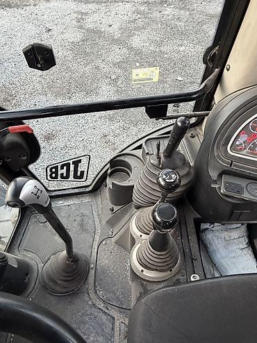 Другие автомобили: Экскаватор-погрузчик JCB желтого цвета.Машина имеет кабину оператора с — 15