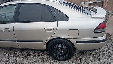 Другие автомобили: Легковой автомобиль седан с аэродинамическим спойлером на крышке — 5