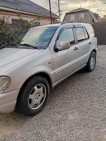 полный комплектация: Mercedes-Benz ML (W163) — интерьер и оснащение - Салон из черной — 7