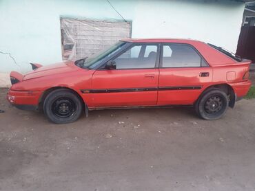 аварийные машины: Mazda 323: 1990 г., 1.8 л, Механика, Бензин, Седан