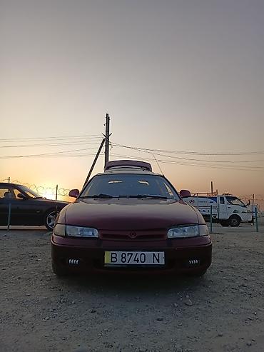 21 диски: Mazda 626: 1996 г., 2 л, Механика, Бензин, Хэтчбэк — 1