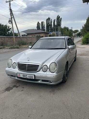 рулевая колонка опель: Серебристый седан Mercedes-Benz E-класса (W210) с характерными