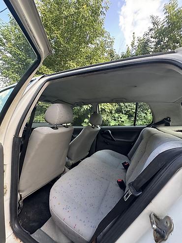 ql 380: Volkswagen Polo: 1996 г., Механика, Седан — 4
