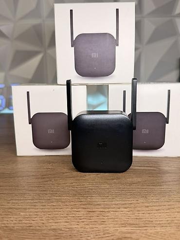 mobil internet modem: Xiaomi Mi WiFi Range Extender Pro – ev və ofisdə zəif siqnalları — 1