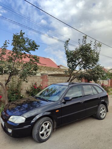 обмен дом на авто: Mazda 323: 1999 г., 1.5 л, Механика, Бензин, Хетчбек