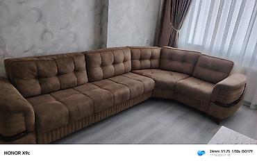 Qonaq otağı üçün künc divan. Geniş oturacaq hissəsinə malikdir və L
