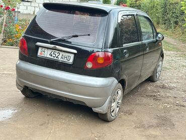 мини электромобиль: Daewoo Matiz — компактный городской хэтчбек черного цвета с серыми