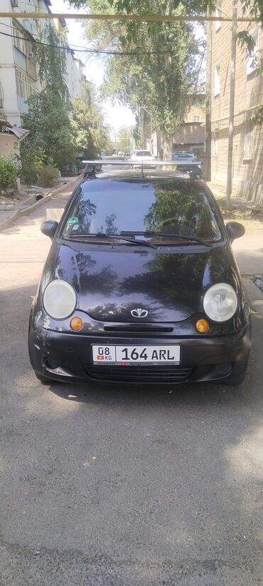 мини электромобиль: Хэтчбек Daewoo Matiz черного цвета, компактный и маневренный, идеально