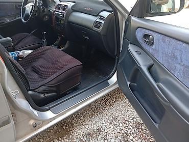 легкий карфакс: Mazda 626: 1998 г., 1.8 л, Механика, Бензин, Хэтчбэк — 7