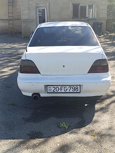 Daewoo: Daewoo Nexia sedan, 4 qapı, ağ rəng. - Kuzov: kompakt sedan, ön — 8