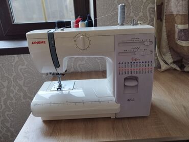 электрическая швейная машинка: Тигүүчү машина Janome