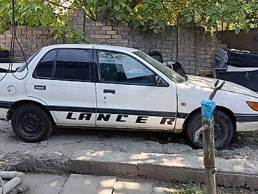 daf 2013: Mitsubishi Lancer: 1990 г., Седан — 2