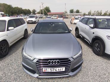 авто тряпка: Автомобиль Audi A6 серого цвета с элегантным дизайном. Оснащен