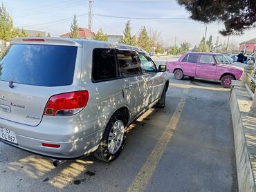 Mitsubishi: Təcili. Mitsubishi Airtrek – gümüş rəngli, şəhər və uzun yol üçün çox — 8