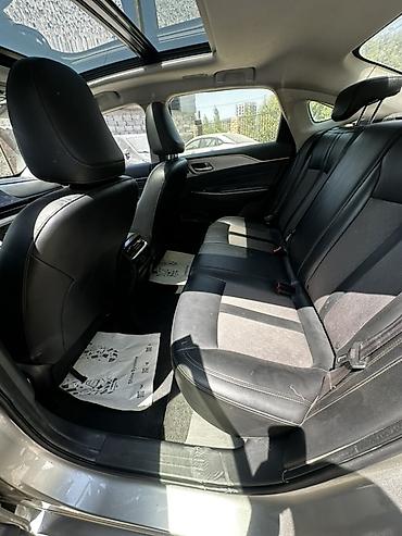 aion a60: GAC Aion S — электрический седан серо‑серебристого цвета. Основные — 8