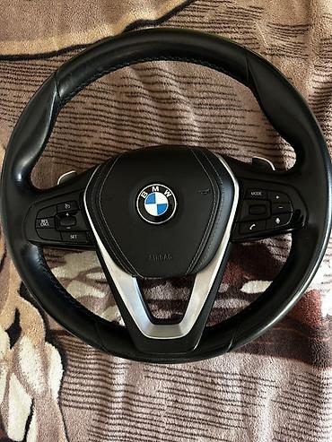 Руль BMW с мультимедийными кнопками и подрулевыми лепестками -