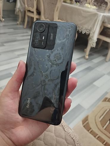 telefon tesla: Redmi Note 12, 256 GB, rəng - Qara, Sensor, Barmaq izi, Simsiz şarj — 1