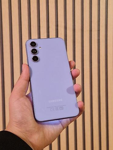 iki: Samsung Galaxy A54 5G, 128 GB, rəng - Bənövşəyi, Zəmanət, Barmaq izi, Simsiz şarj — 1
