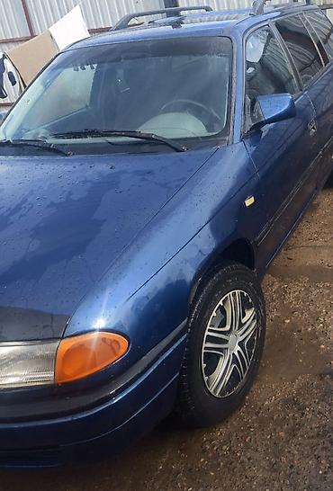 потолок авто: Opel Astra F Caravan (универсал), синего цвета. Кузов и экстерьер: - — 3