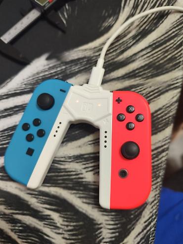 Nintendo Switch: Зарядная рукоятка-держатель для контроллеров Nintendo Switch Joy‑Con — 2