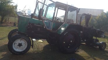 Traktorlar: YUMZ traktor – böyük kabinalı model Xüsusiyyətlər: - Dizel mühərrik — 6