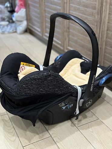 детские автокресла от 0 до 36 кг: Детское автокресло-переноска Maxi-Cosi (группа 0+) - Установка против — 2